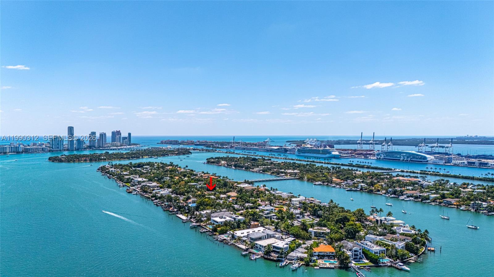 This aerial view shows a residential island surrounded by water with a red arrow marker — 116 W 1st Ct, Miami Beach FL 33139, MIAMI BEACH, FL