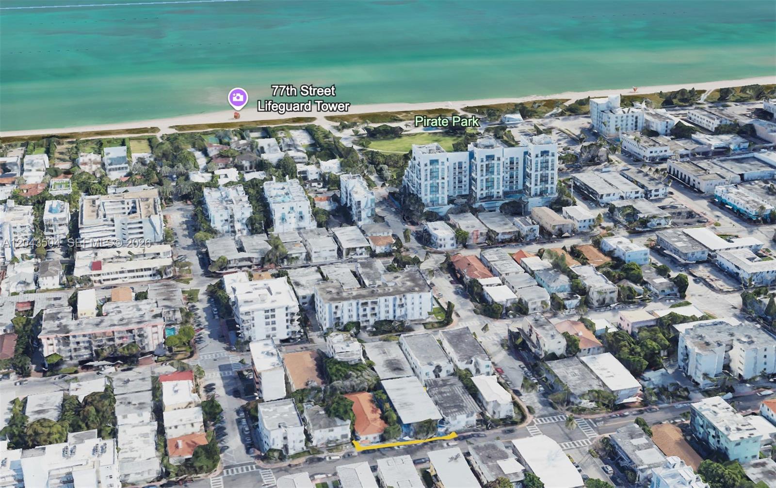 This aerial view shows a residential neighborhood near the beach, a park, and a lifeguard tower — 7717 Byron Ave, Miami Beach FL 33141, MIAMI BEACH, FL