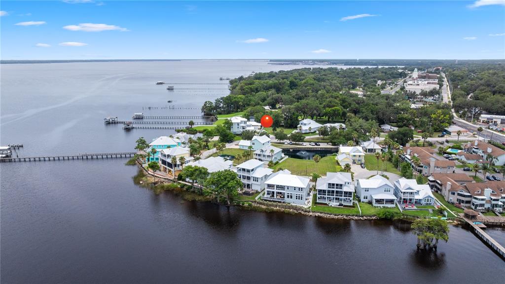A two-story light blue house with a metal roof and a paved driveway — 101 YACHT CLUB POINT, GREEN COVE SPRINGS, FL