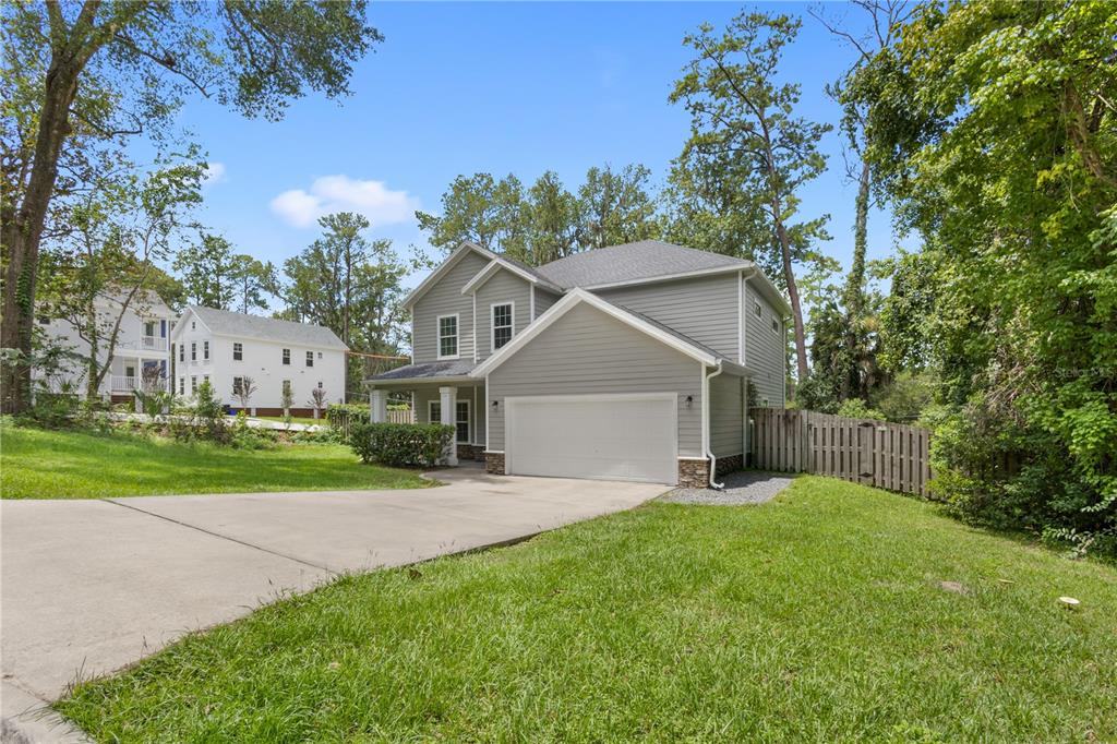 A two-story gray house with a two-car garage and a concrete driveway — 16 NW 29 STREET, GAINESVILLE, FL