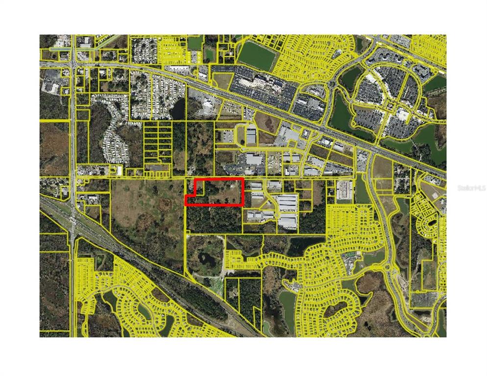 This is an aerial map showing a property outlined in red within a suburban area — 5653 COUNTY ROAD 181, WILDWOOD, FL