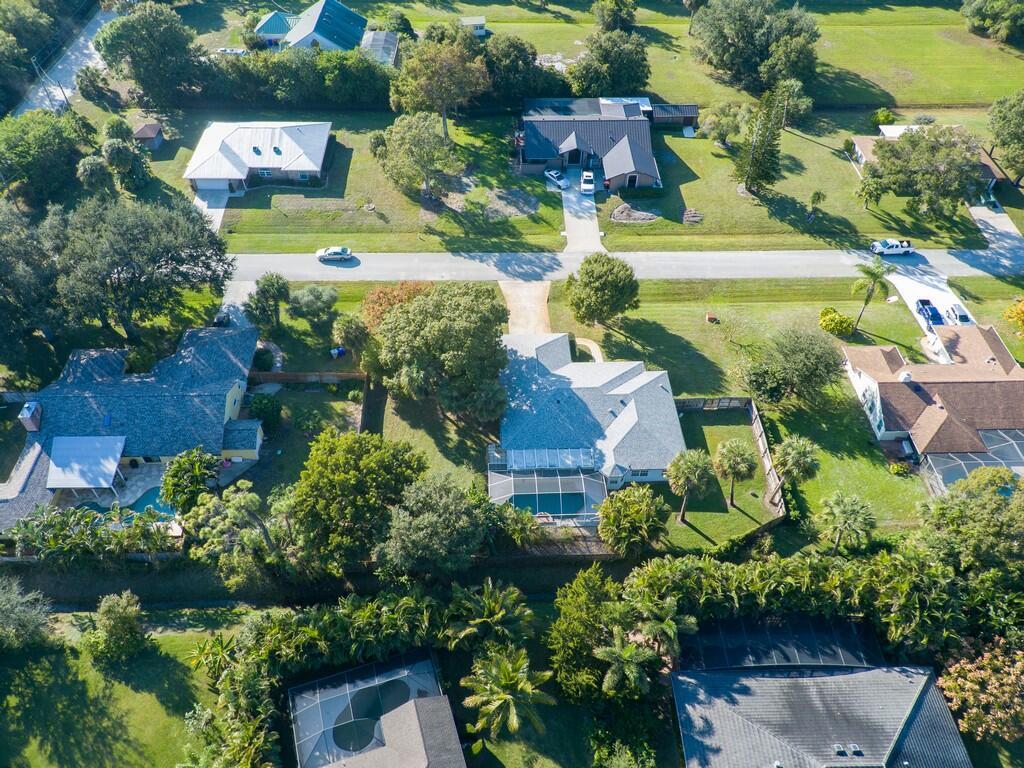 An aerial view of suburban houses with swimming pools and lush green landscaping — 6130 60th Court, Vero Beach FL 32967, VERO BEACH, FL