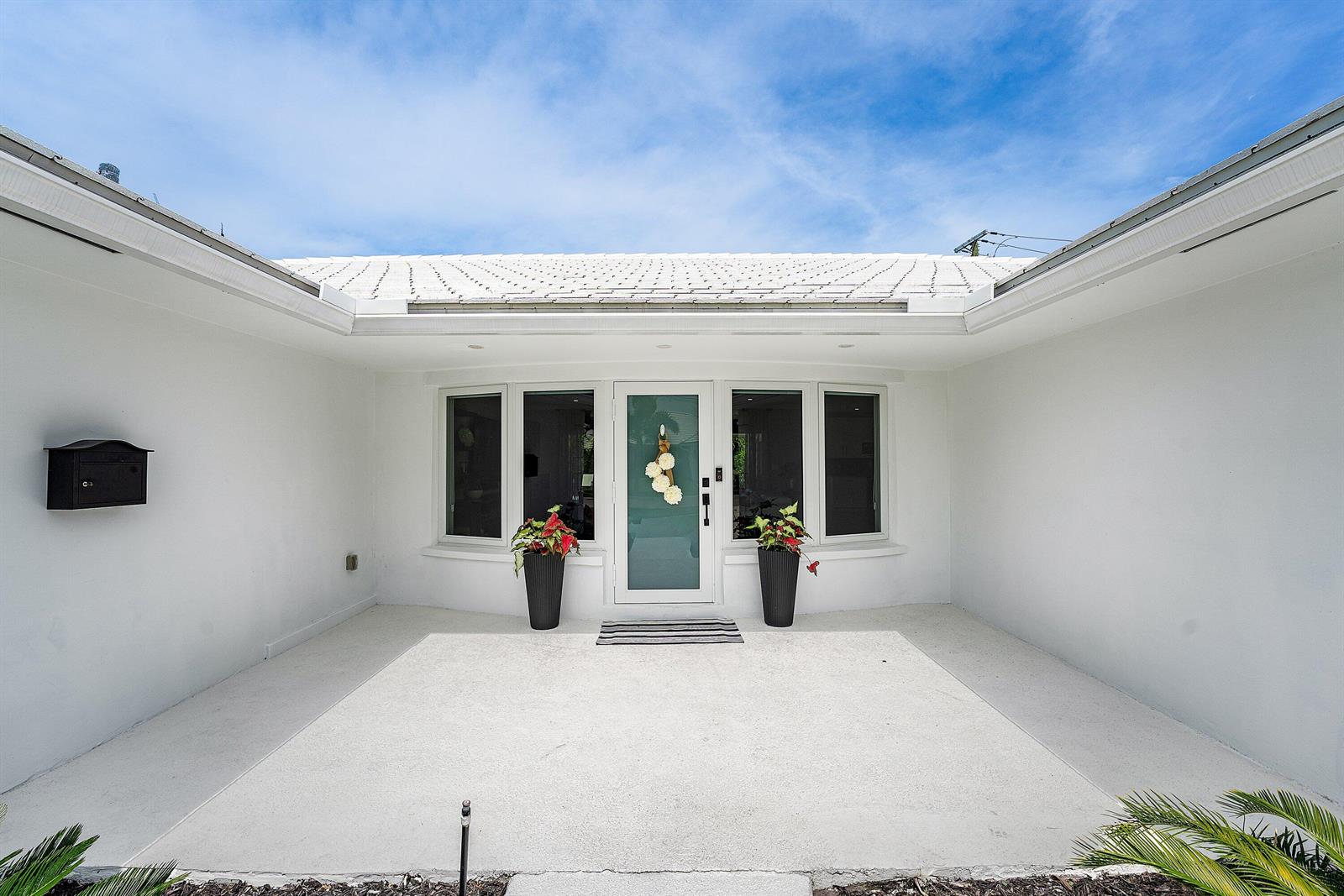 The exterior view shows a white house with a front porch, entryway, and potted plants — 1298 Walnut Terrace, Boca Raton FL 33486, BOCA RATON, FL