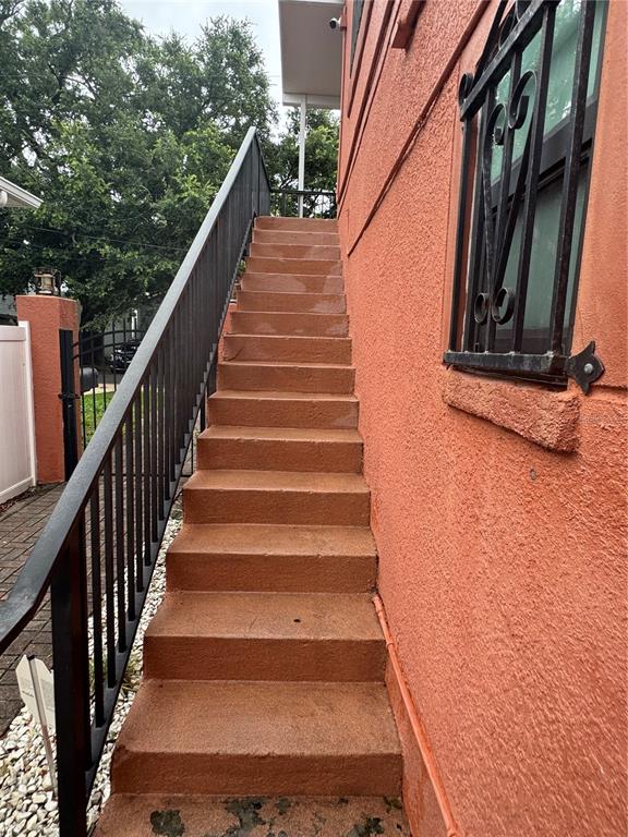 An exterior view of a set of concrete stairs leading up to a building entrance — 2205 CHIPCO STREET UNIT C, TAMPA, FL