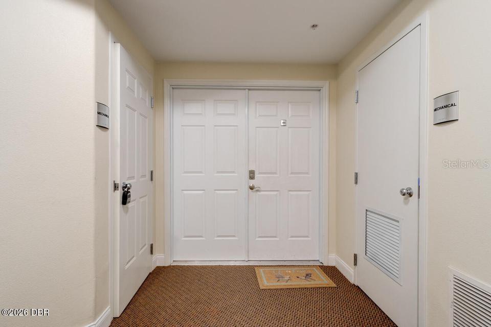 A hallway features a central double door flanked by two doors labeled mechanical — 3737 S ATLANTIC AVENUE UNIT 401, DAYTONA BEACH SHORES, FL