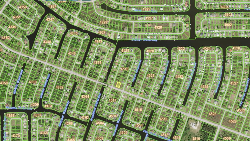 This is a satellite map showing residential lots and waterways in a suburban neighborhood — 14634 INGRAHAM BOULEVARD, PORT CHARLOTTE, FL