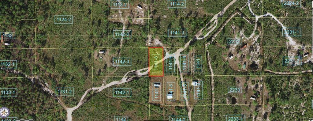 This aerial map shows a rectangular parcel of land highlighted in red among surrounding lots — HOLOPAW GROVES ROAD, ST CLOUD, FL