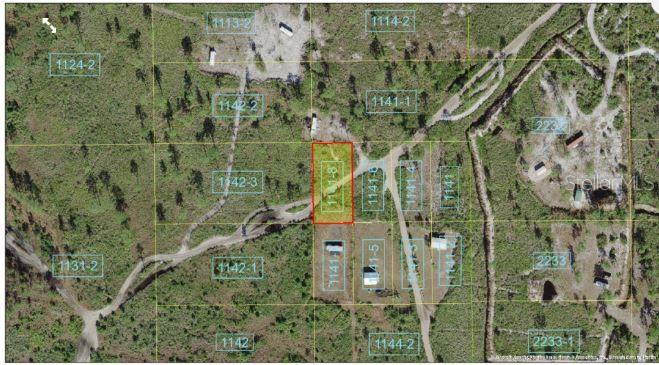 This aerial map shows a highlighted rectangular land parcel surrounded by dirt roads and vegetation — HOLOPAW GROVES ROAD, ST CLOUD, FL