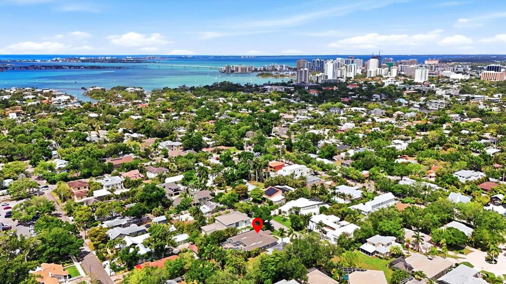 An aerial view shows a residential neighborhood with a red pin marking a house — 1880 LOMA LINDA STREET, SARASOTA, FL