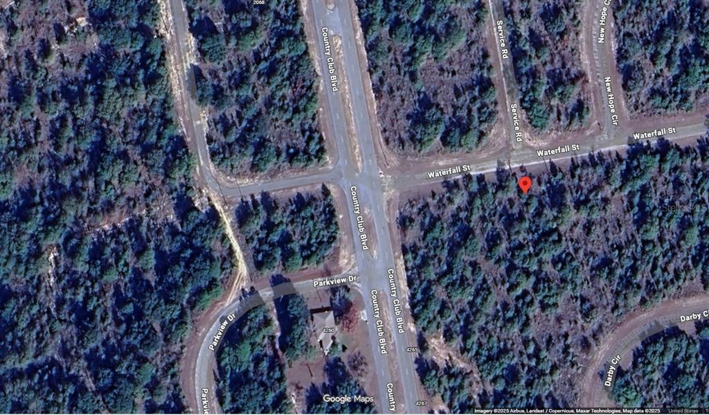 This is a satellite map view showing a vacant, wooded lot marked by a red pin — Lot 3 Unit 2 Blk 210 WATERFALL STREET, CHIPLEY, FL