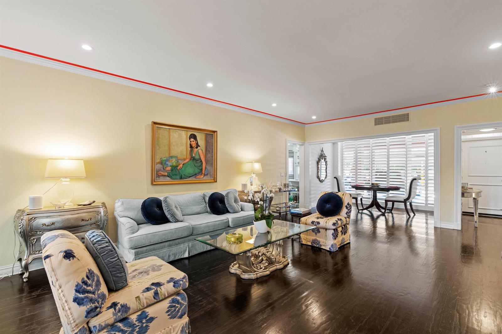 A living room features a light blue sofa, patterned armchairs, and dark hardwood flooring — 315 S Lake Drive # 1a, Palm Beach FL 33480, PALM BEACH, FL