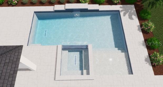 A digital rendering of a rectangular swimming pool with an attached spa and stone patio — 12630 HARNEY STREET, VENICE, FL