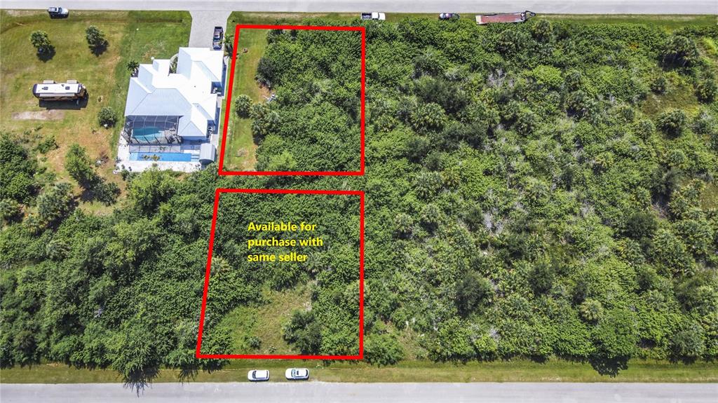 An aerial view shows two vacant, wooded lots outlined in red next to a house — 15707 MARGO CIRCLE, PORT CHARLOTTE, FL