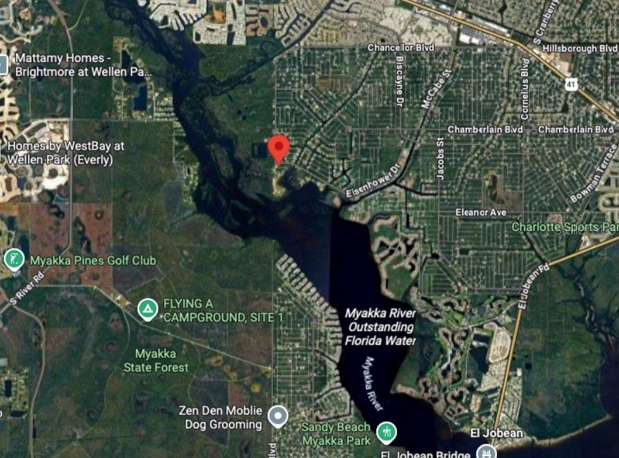 This is a satellite map showing a residential area near the Myakka River in Florida — 12037 EISENHOWER DRIVE, PORT CHARLOTTE, FL