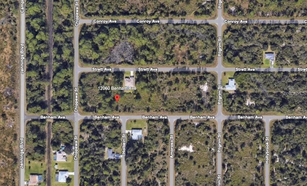 This is an aerial map view of a wooded residential area with platted streets — 12060 BENHAM AVENUE, PORT CHARLOTTE, FL