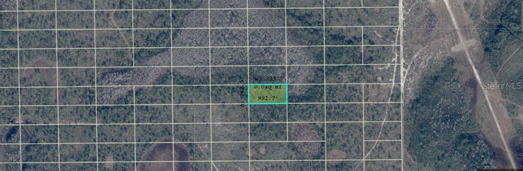 An aerial map shows a rectangular plot of land highlighted in blue against a grid — DILL ROAD, ORLANDO, FL