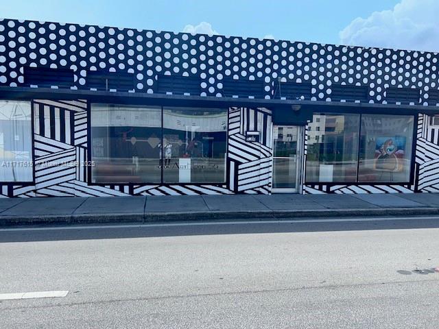 The exterior of a commercial building features a black and white polka-dot and striped facade — 5600 NW 7th Ave, Miami FL 33127, MIAMI, FL