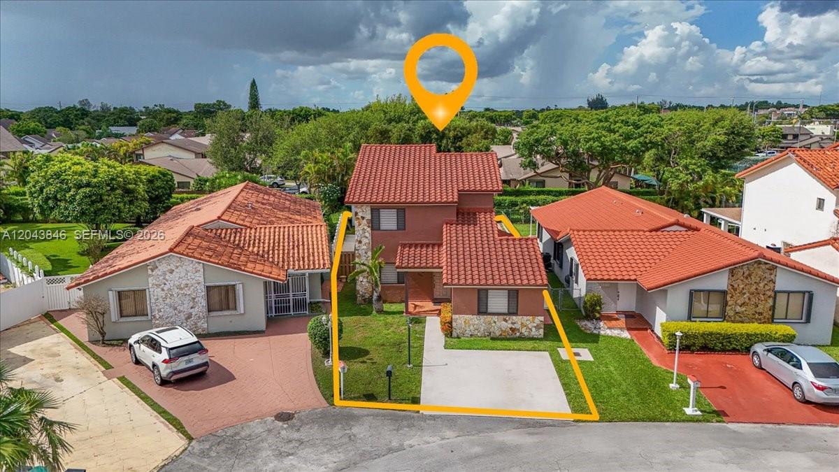 An aerial view shows a two-story house with a red tile roof and stone accents — 10528 SW 69th Ter, Miami FL 33173, MIAMI, FL