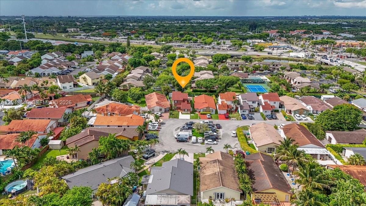 An aerial view shows a residential neighborhood with a marked house and a central parking area — 10528 SW 69th Ter, Miami FL 33173, MIAMI, FL