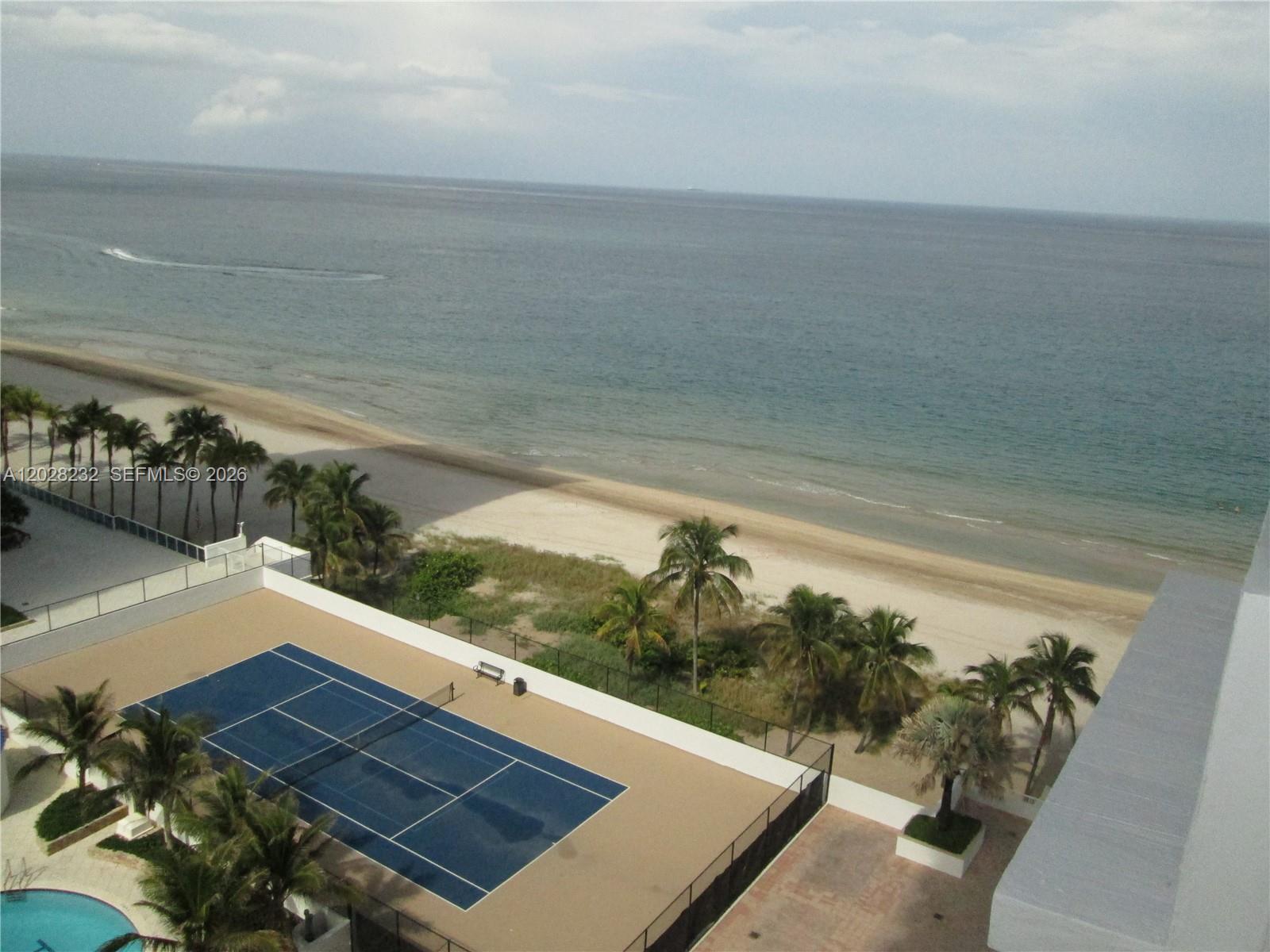 An elevated view shows a tennis court next to a beach and the ocean — 1370 S Ocean Blvd # 1206, Pompano Beach FL 33062, POMPANO BEACH, FL