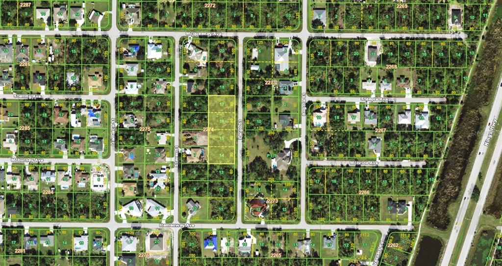 This is an aerial map showing a residential neighborhood with plotted property lines and streets — 2401 LARGO STREET, PUNTA GORDA, FL