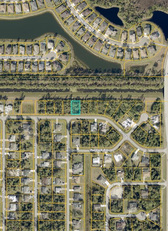 This is an aerial map showing a highlighted vacant residential lot in a suburban neighborhood — WENONA DRIVE, NORTH PORT, FL