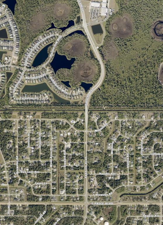 This is an aerial map view of a residential neighborhood with streets and a lake — WENONA DRIVE, NORTH PORT, FL