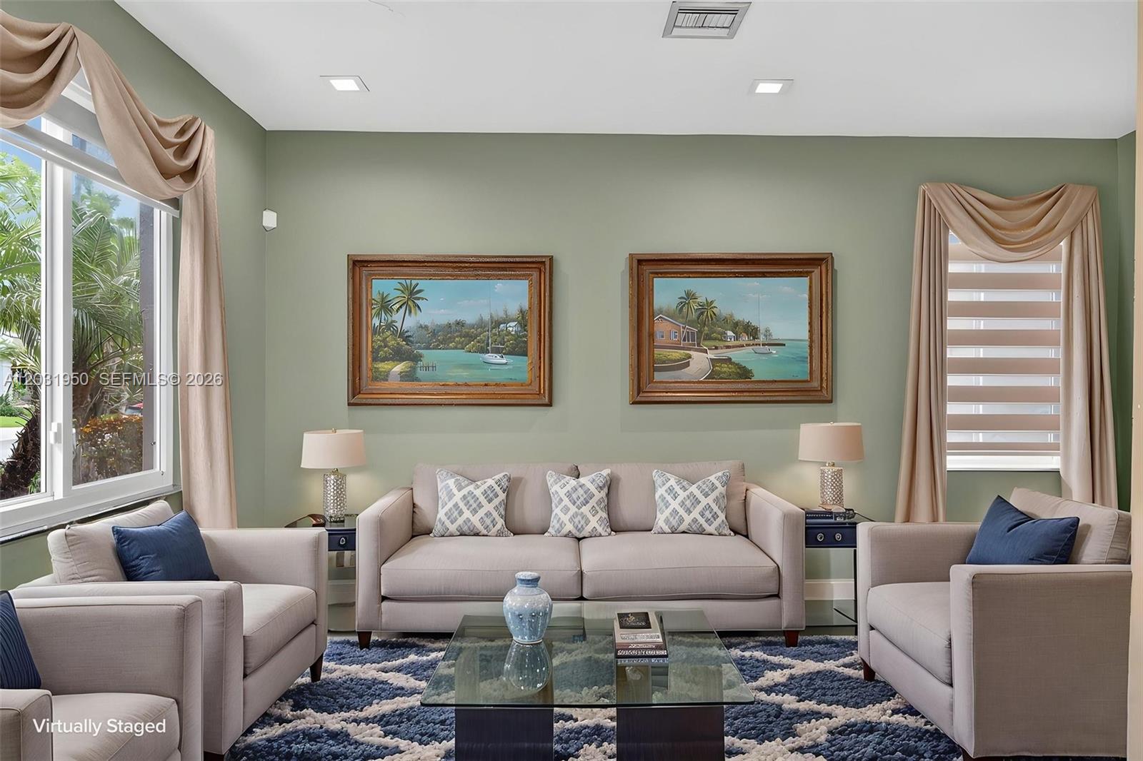 A living room features a beige sofa, two armchairs, a glass coffee table, and two paintings — 830 Hawthorn Ter, Weston FL 33327, WESTON, FL