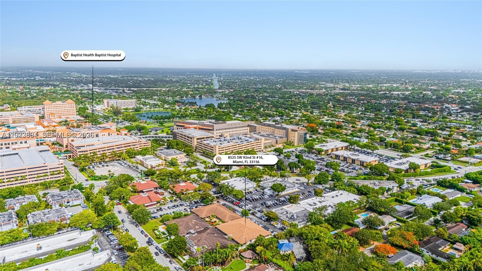 This is an aerial view of a suburban area featuring a hospital complex and parking — 8525 SW 92nd St # 16, Miami FL 33156, MIAMI, FL