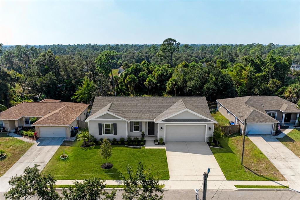 An aerial view of a single-story suburban house with a gray roof and garage — 4263 GALVIN LANE, NORTH PORT, FL