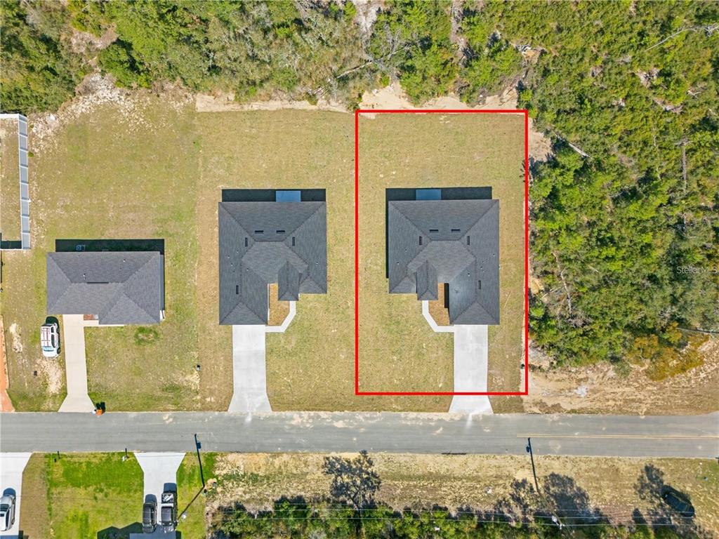 An aerial view shows a house with a dark roof on a rectangular lot — 16753 SW 29TH TERRACE, OCALA, FL