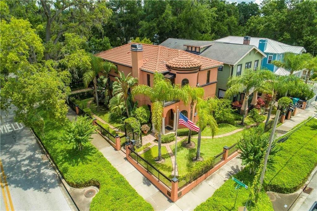 An aerial view of a two-story peach-colored house with a red tile roof — 503 N SUMMERLIN AVENUE, ORLANDO, FL