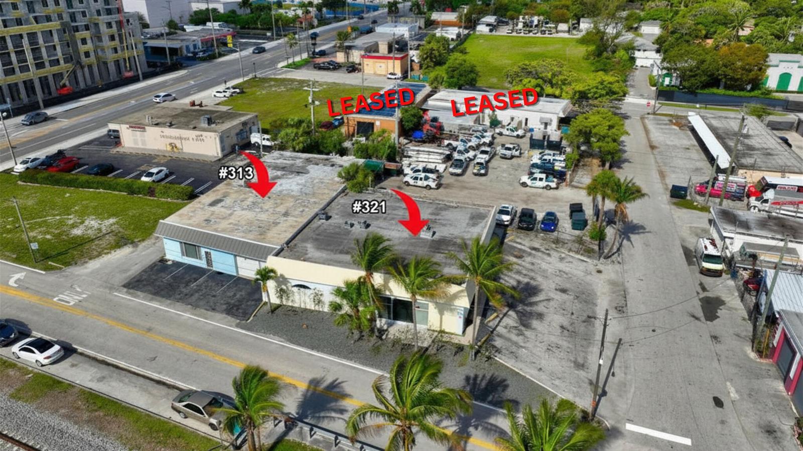 An aerial view shows two commercial buildings with flat roofs and adjacent parking lots — 321 N Railroad Avenue, Boynton Beach FL 33435, BOYNTON BEACH, FL