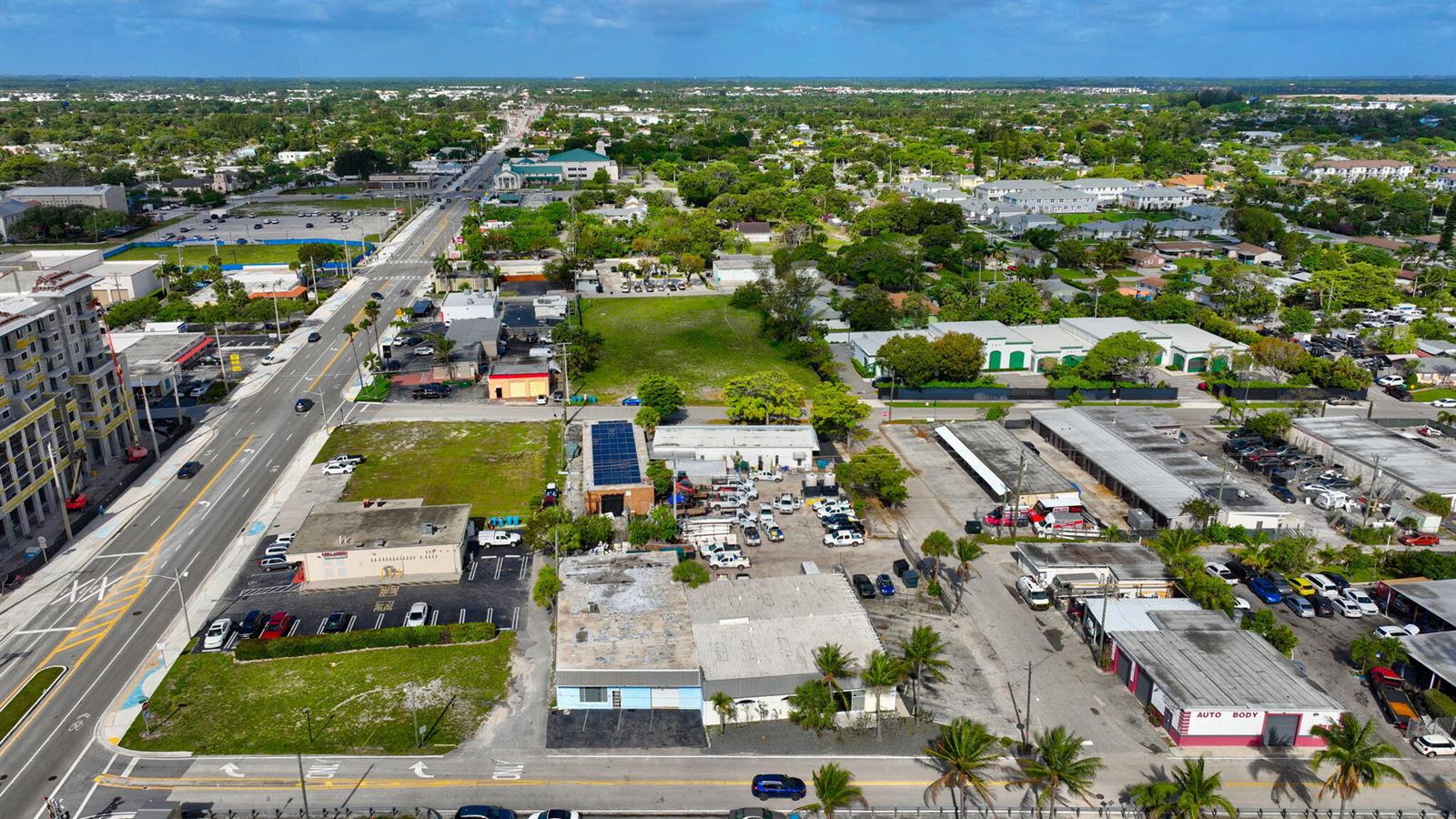 An aerial view shows a commercial area with buildings, parking lots, and a main road — 321 N Railroad Avenue, Boynton Beach FL 33435, BOYNTON BEACH, FL