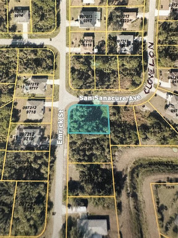 This is an aerial map showing a highlighted vacant lot at a street intersection — CLOVELON STREET, NORTH PORT, FL