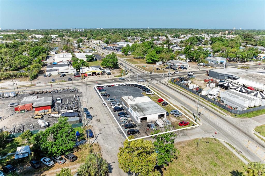 An aerial view shows a commercial property with a building and parking lot — 2929 9TH STREET W, BRADENTON, FL