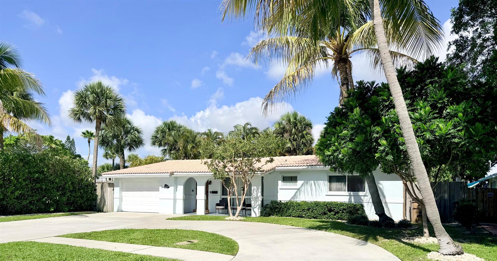 A single-story white house with a tile roof, a garage, and palm trees in front — 401 SE 3rd Terrace, Deerfield Beach FL 33441, DEERFIELD BEACH, FL