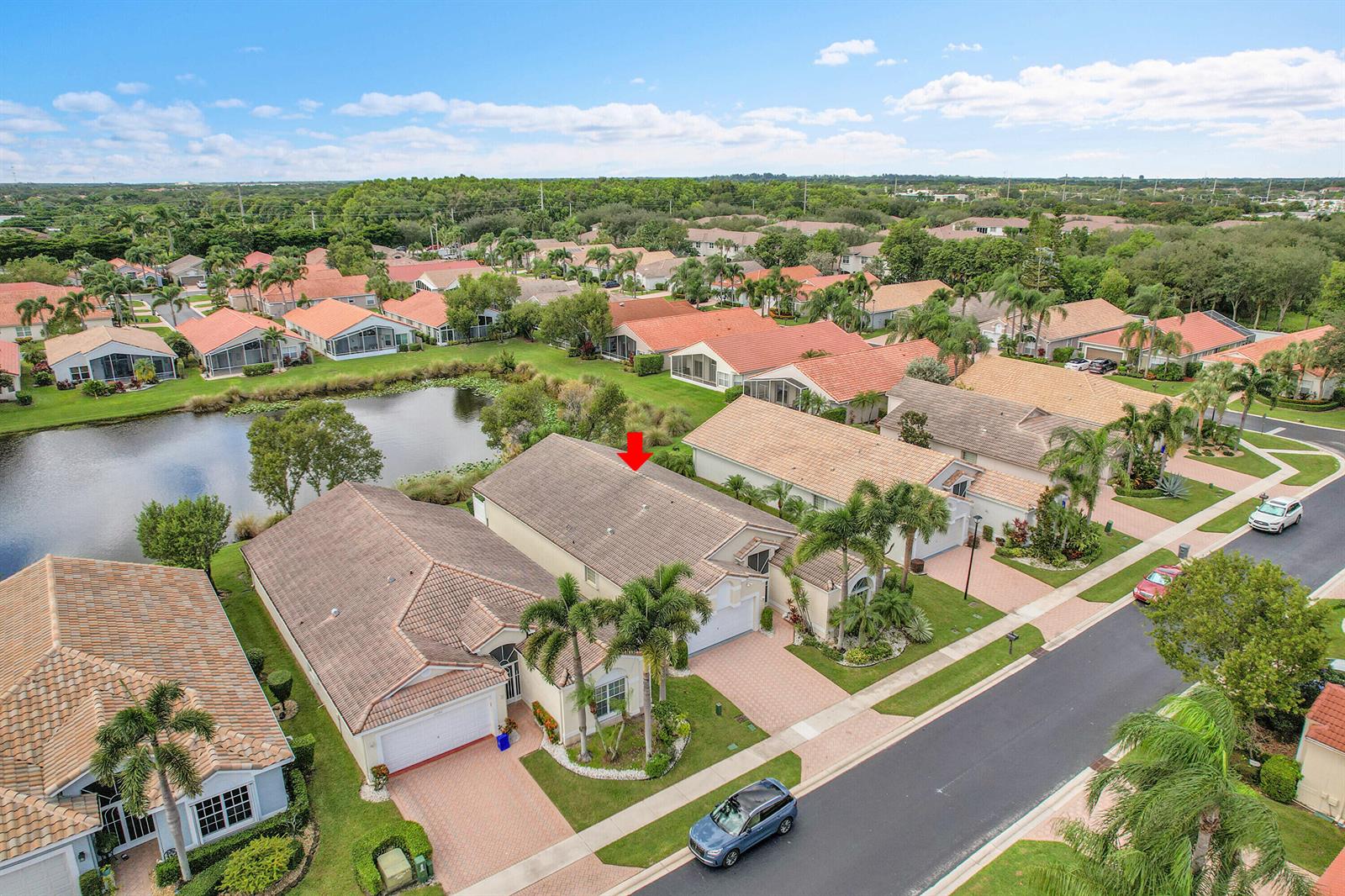An aerial view shows a suburban house with a tiled roof and palm trees — 10382 Utopia Circle E, Boynton Beach FL 33437, BOYNTON BEACH, FL