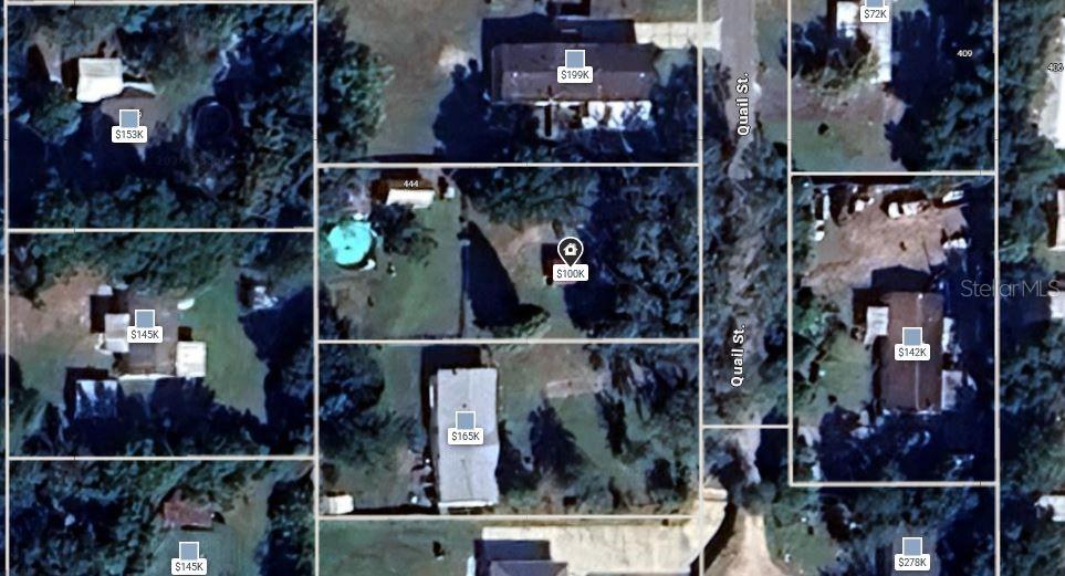 This is an aerial map showing several residential properties and their estimated values — 444 QUAIL STREET, LADY LAKE, FL