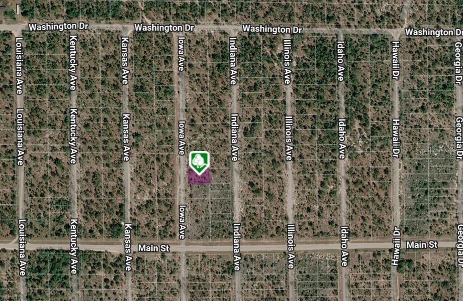 This is an aerial map showing a vacant lot highlighted in a residential grid — Lot 33 and 34 IOWA AVENUE, HAWTHORNE, FL