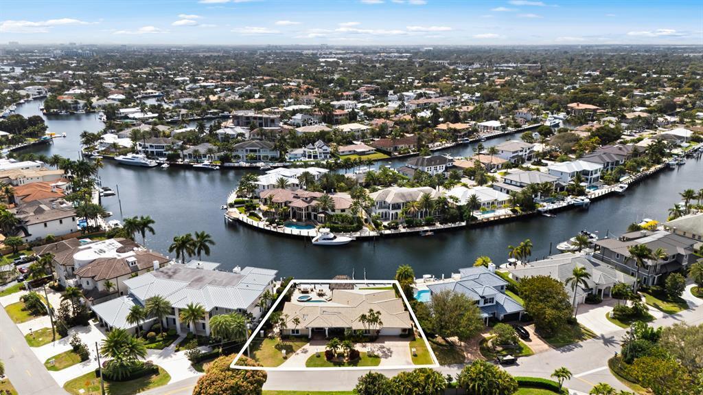 An aerial view shows a single-story house with a pool, highlighted by a white border — 2600 NE 33rd Street, Lighthouse Point FL 33064, LIGHTHOUSE POINT, FL