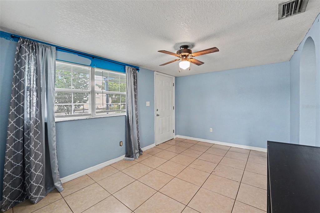 This is a floor plan for a residential unit with three bedrooms and two bathrooms — 406 NW PHOSPHATE BOULEVARD, MULBERRY, FL