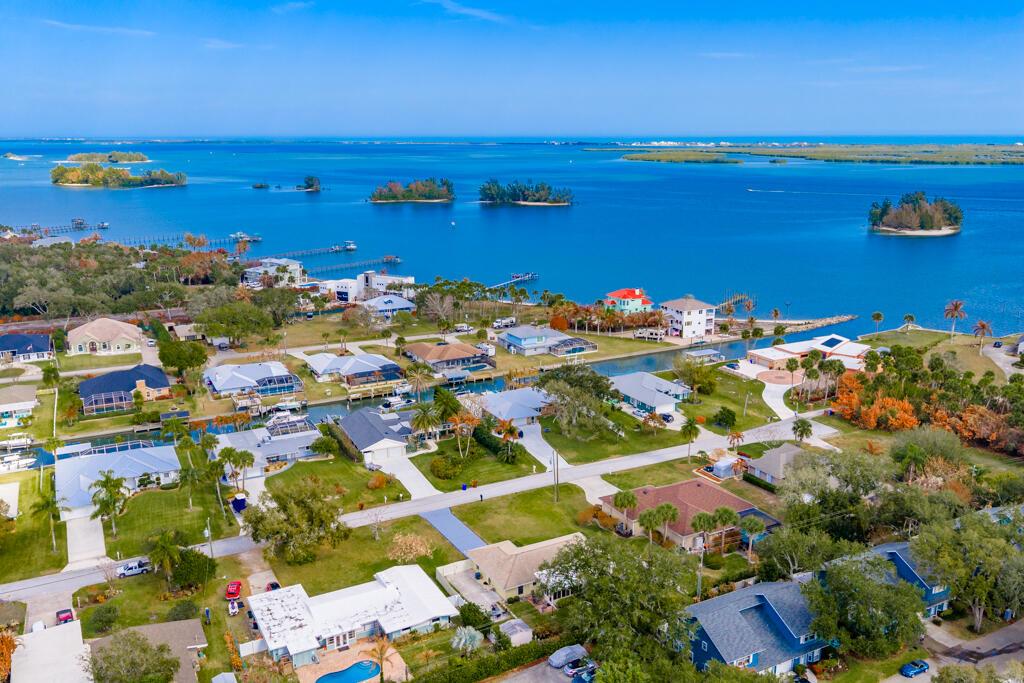 An aerial view of a waterfront residential neighborhood with houses, canals, and small islands — 6655 110th Street, Sebastian FL 32958, SEBASTIAN, FL