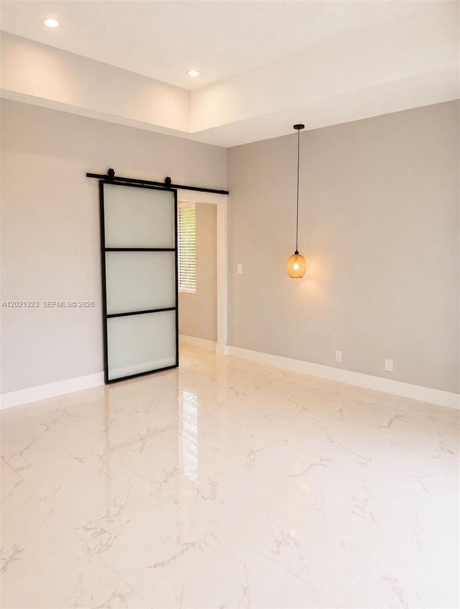 A room with white marble-look tile flooring, light gray walls, and a sliding glass door — 354 Mallard Rd # o, Weston FL 33327, WESTON, FL