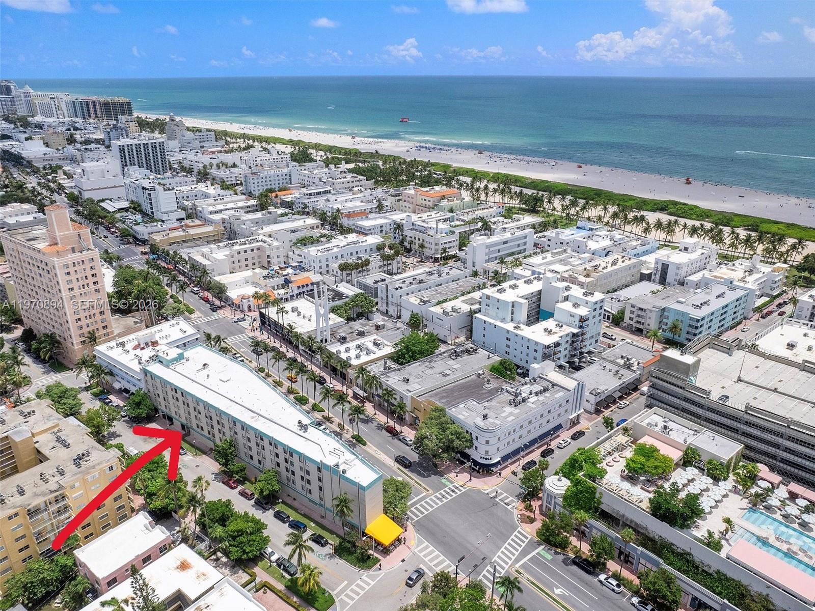An aerial view shows a multi-story building in a dense urban coastal neighborhood — 710 Washington Ave, Miami Beach FL 33139, MIAMI BEACH, FL