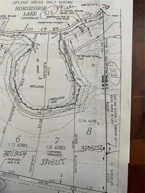 This is a land survey map showing property boundaries, wetland areas, and acreage for several lots — 17937 COUNTY ROAD 448, MOUNT DORA, FL