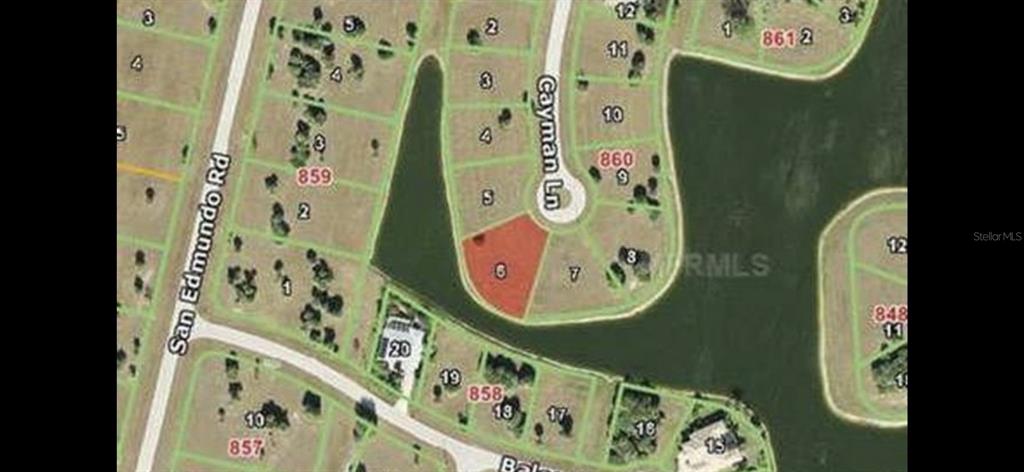 This is a satellite map view showing a highlighted residential lot at the end of a cul-de-sac — 16309 CAYMAN LANE, PUNTA GORDA, FL