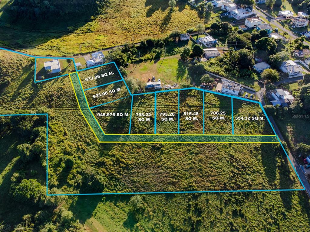 This aerial view shows a large plot of land subdivided into several residential lots — 480 CALLE S. TOSADO, QUEBRADILLAS, PR