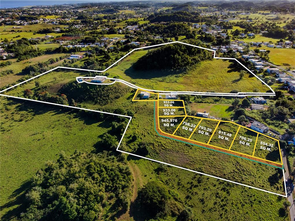 This aerial view shows a large plot of land with several smaller subdivided residential lots — 480 CALLE S. TOSADO, QUEBRADILLAS, PR