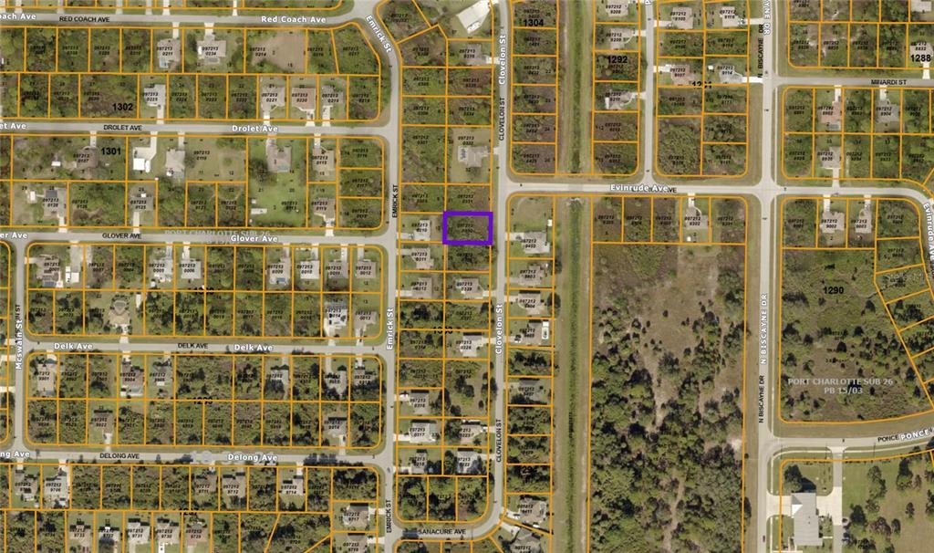 This is a satellite map view of a residential neighborhood with a highlighted vacant lot — Lot 30 CLOVELON STREET, NORTH PORT, FL